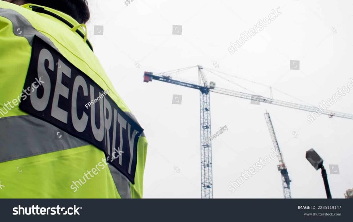 stock photo parking security watching over parking lot and construction site 2285119147